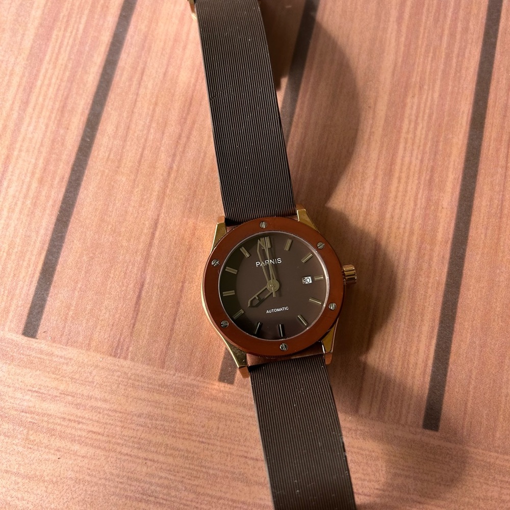 Men’s PARNIS watch (needs new band). Fully functional. Brown and gold colored.